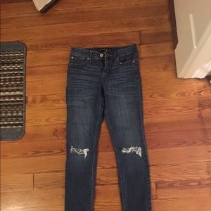 Mid Rise Super Skinny Distressed Express Jeans